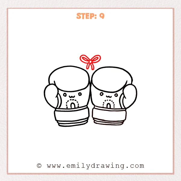 how to draw a boxing gloves - Step 9 of an easy boxing gloves drawing adding a small centered bow above the two cute gloves.